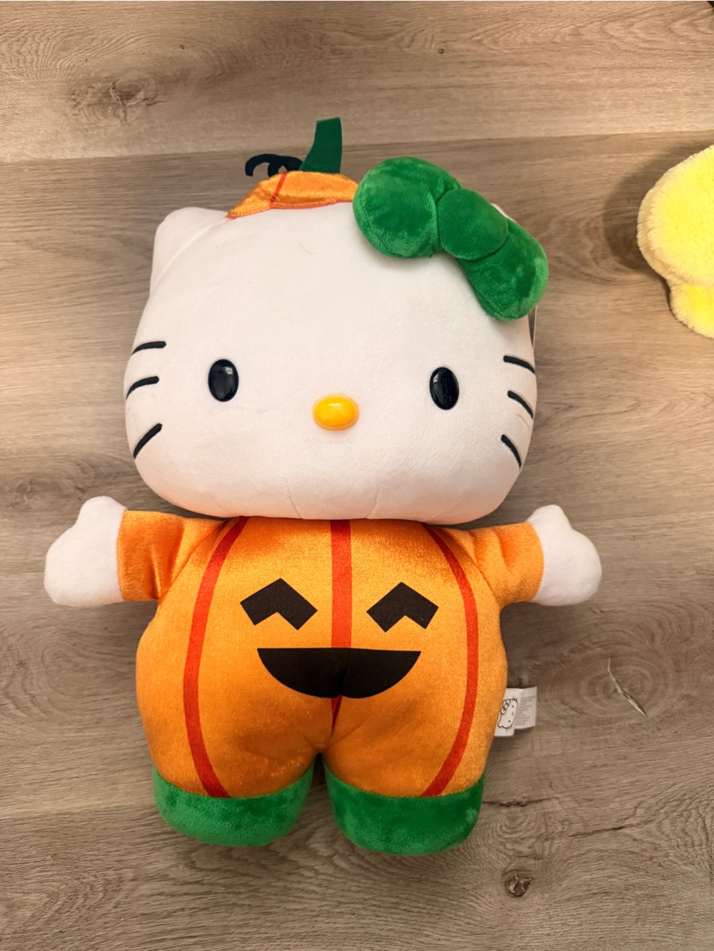 Sanrio Hello Kitty Plush in Orange Pumpkin Costume with Green Bow